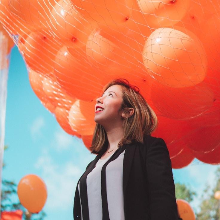 Alex Carter, Head Design Curator at Brook Line Niche, reviewing corporate floral arrangements